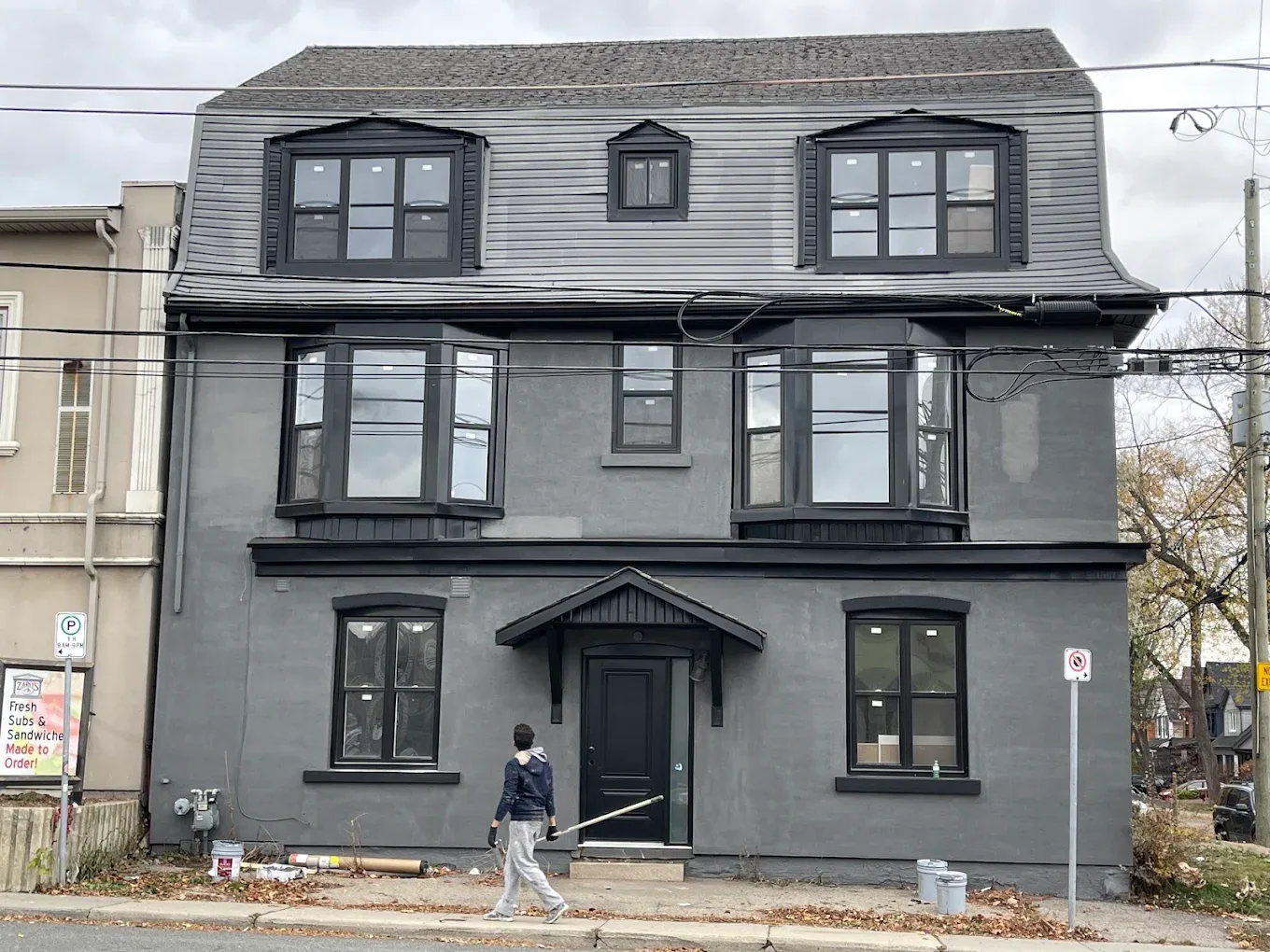 Commercial property exterior during surface preparation and painting