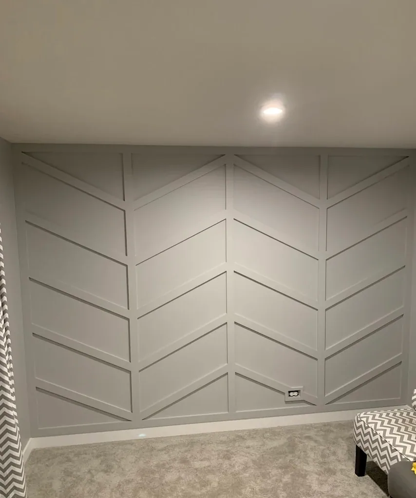Soft grey feature wall with a raised chevron pattern